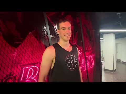 Riley Allenspach talks to the media during summer workouts